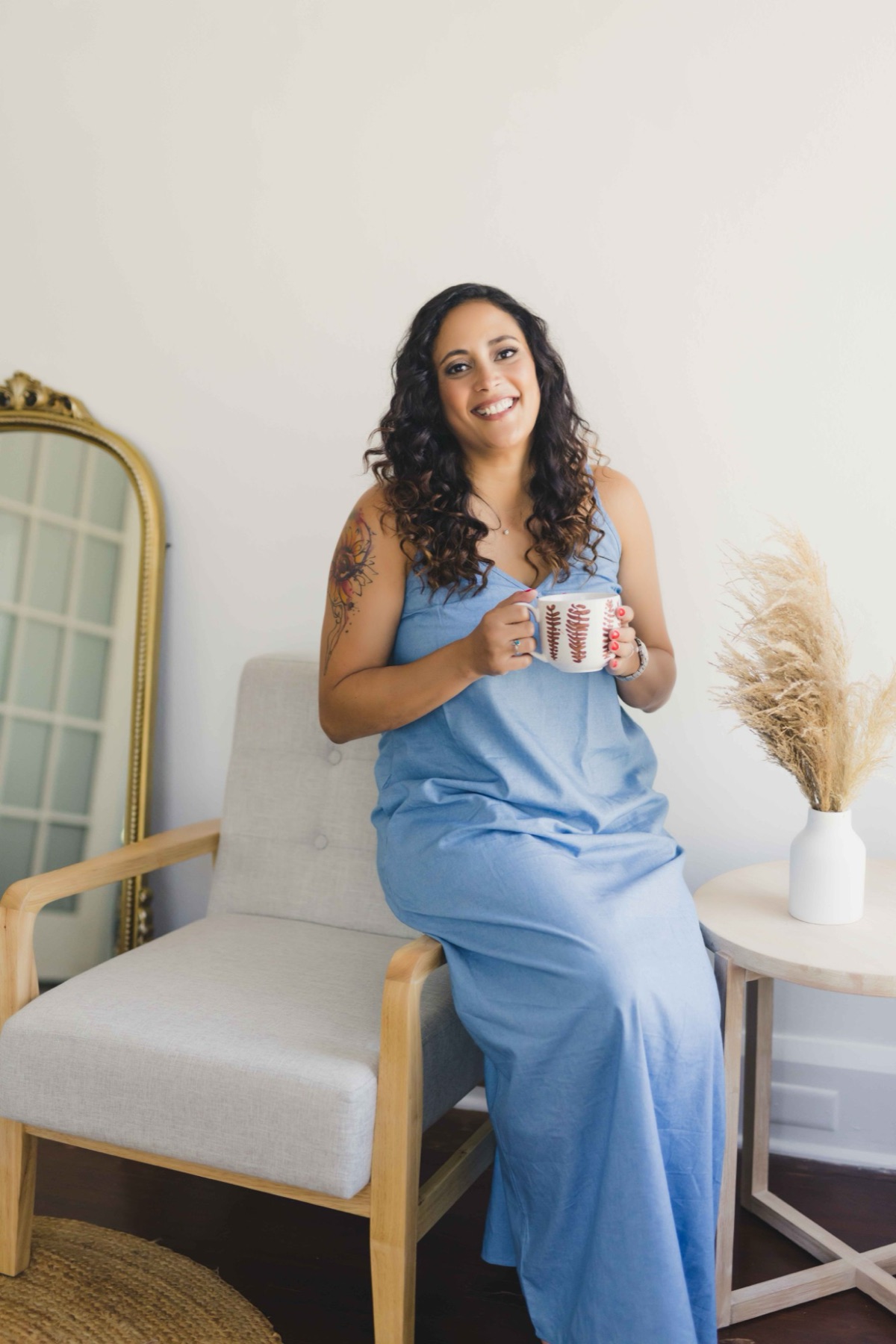 Jessica Rios-Flores, LCSW, smiling and holding a mug